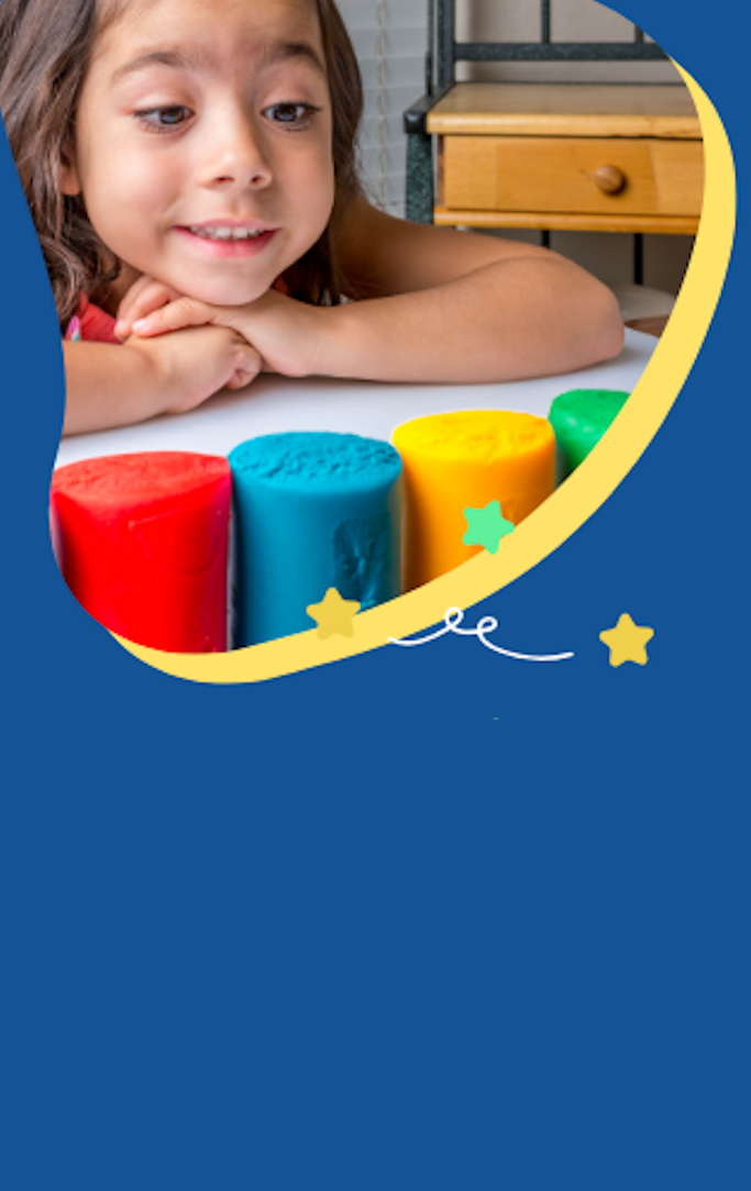 Girl looking excitedly at a row of Playdough canisters